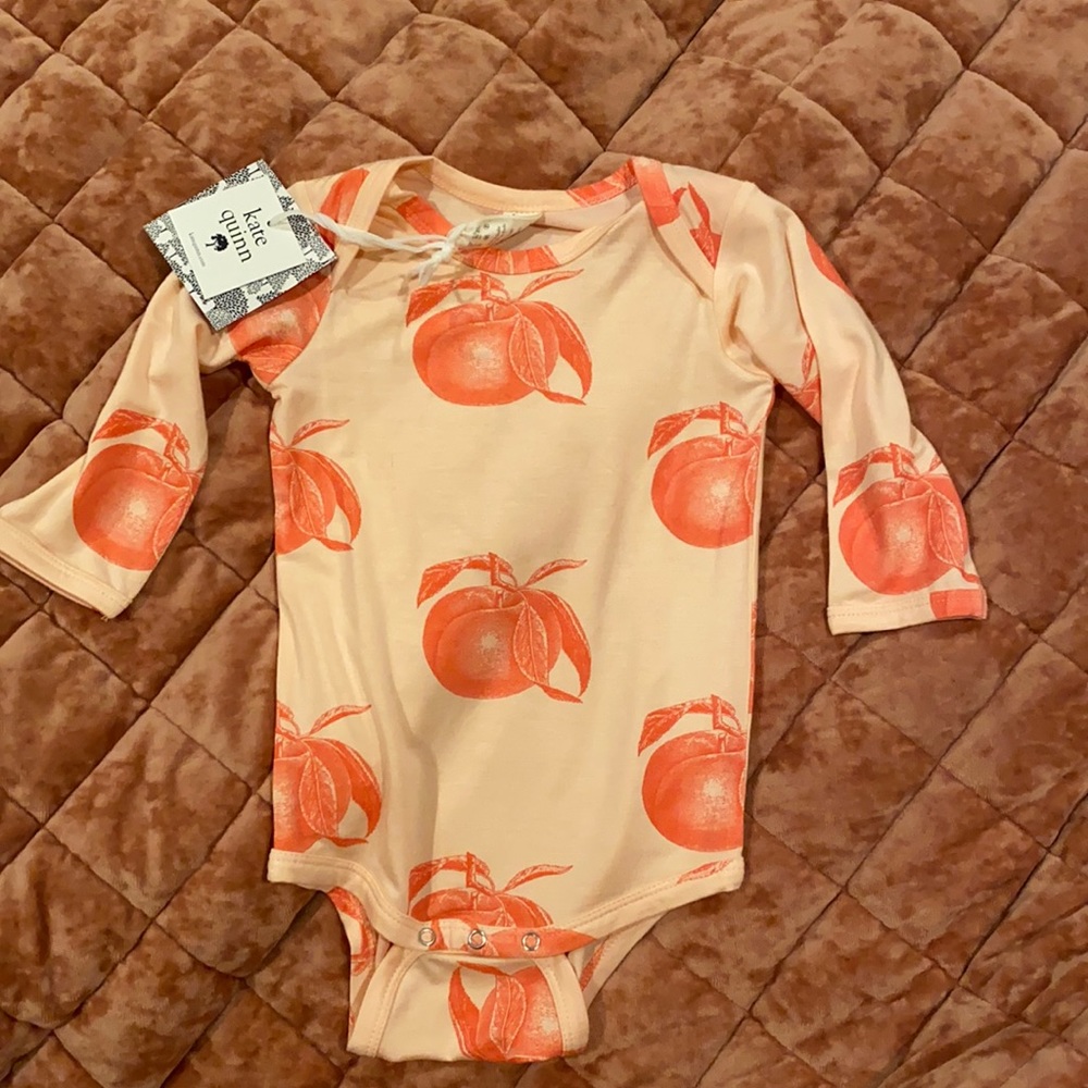 Kate Quinn long sleeve peace’s bodysuit